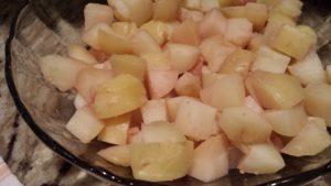 Sprinkle red vinegar onto the potatoes and stir to mix (Photo Credit: Adroit Ideals)