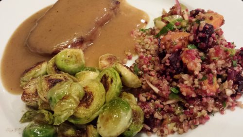 Autumn Harvest Super Grains Salad accompanies a grilled pork chop with cognac pan sauce and sauteed Brussels sprouts (Photo Credit: Adroit Ideals)