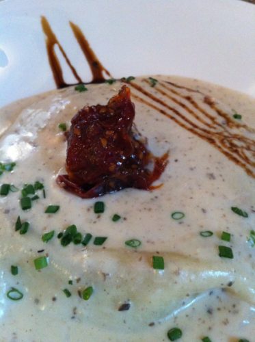The decadent rabbit lasagna with camembert sauce at Lapin Saute in Quebec City (Photo Credit: Adroit Ideals)
