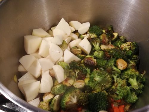 Add potatoes and roasted vegetables