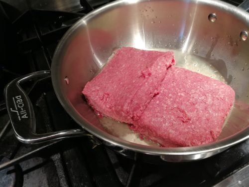 Put ground beef in skillet