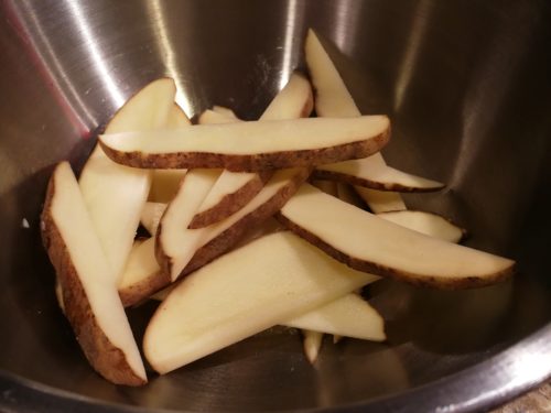 Potato slices in bowl 