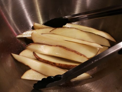 toss potatoes with oil