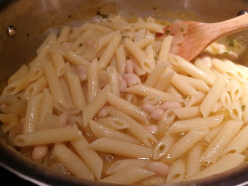 Add cooked penne to pan