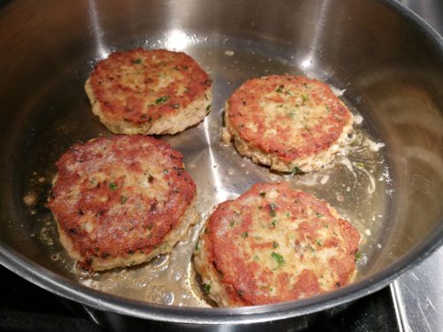 Salmon patties are golden brown and done