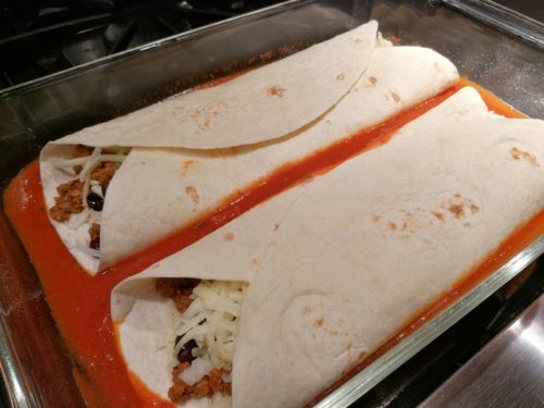 roll enchiladas and place in pan