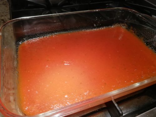 enchilada sauce in baking dish