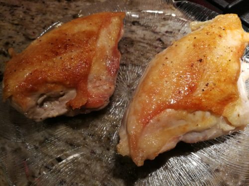 sear the chicken breasts until the skin is golden brown