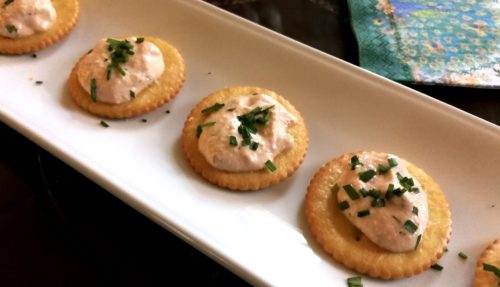 smoked salmon dip on cracker with chives