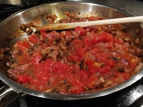 Add tomatoes and vegetable stock