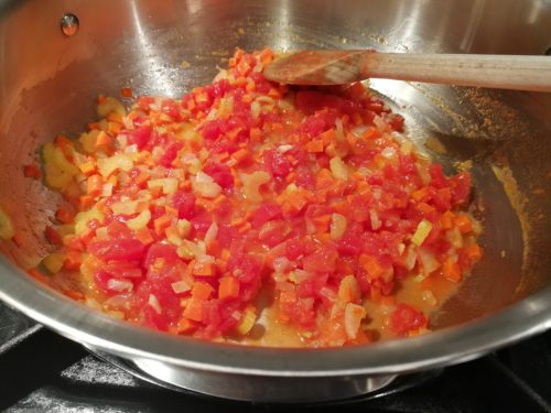 Saute onion, carrot, celery and add chopped tomatoes