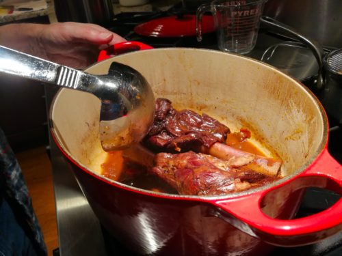 Ladle the sauce over the lamb shanks while they braise