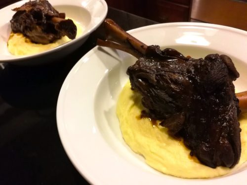 Put the lamb shanks on top of the mashed potatoes