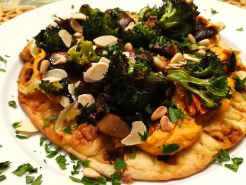Roasted Vegetables and Roasted Red Pepper Hummus top a Warmed Naan Bread