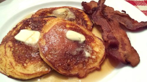 Fluffy buttermilk pancakes with a side of bacon