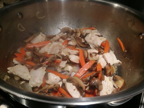 Add the sauteed chicken to the vegetables