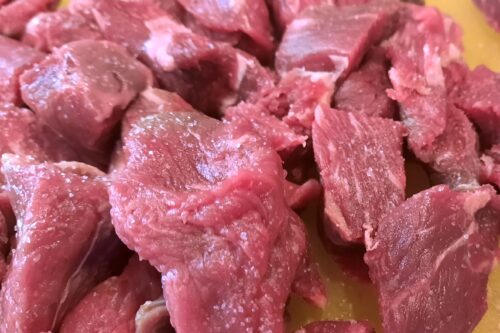 Season beef cubes with salt and pepper