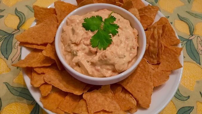 Serve my Easy Queso Dip warm or chilled with tortilla chips (Photo Credit: Adroit Ideals)